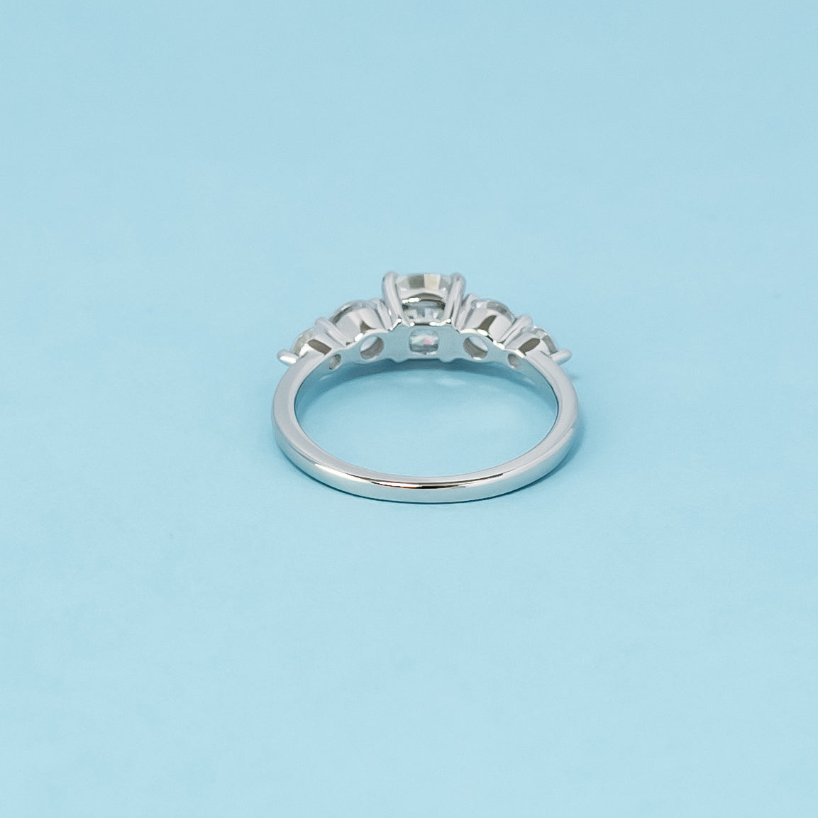 Luxurious 9ct white gold engagement ring with five beautiful cushion cut moissanites, symbolizing enduring love and commitment.