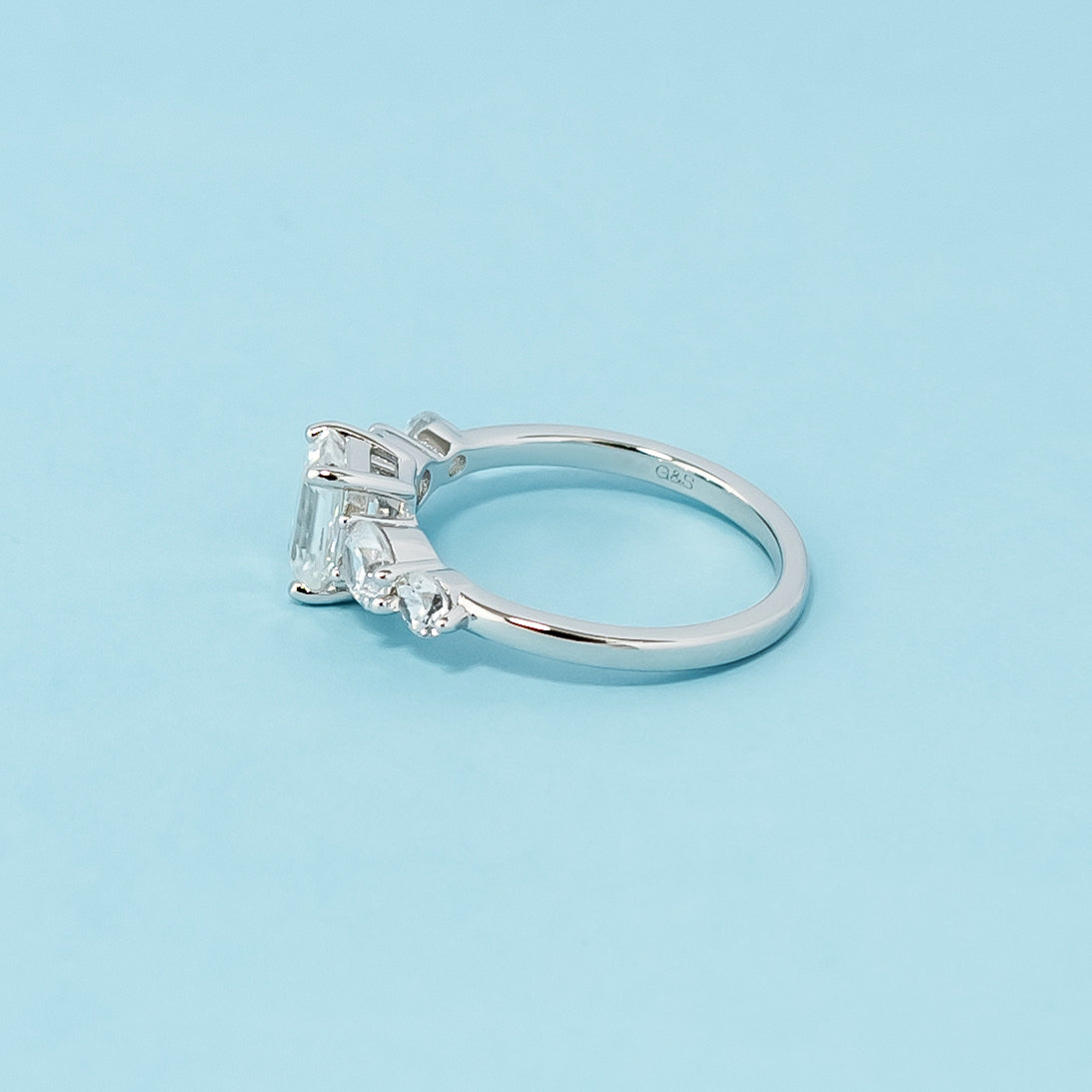 Stunning five-stone engagement ring showcasing the brilliance and clarity of emerald cut moissanites, crafted in 9ct white gold.