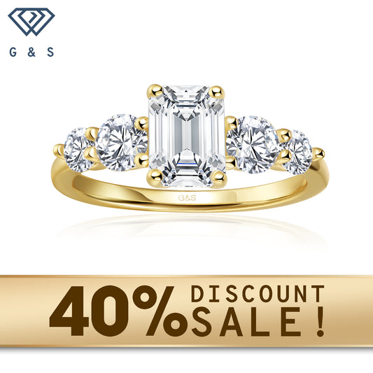 A 9ct yellow gold engagement ring featuring five elegant emerald cut moissanites, symbolizing enduring love.