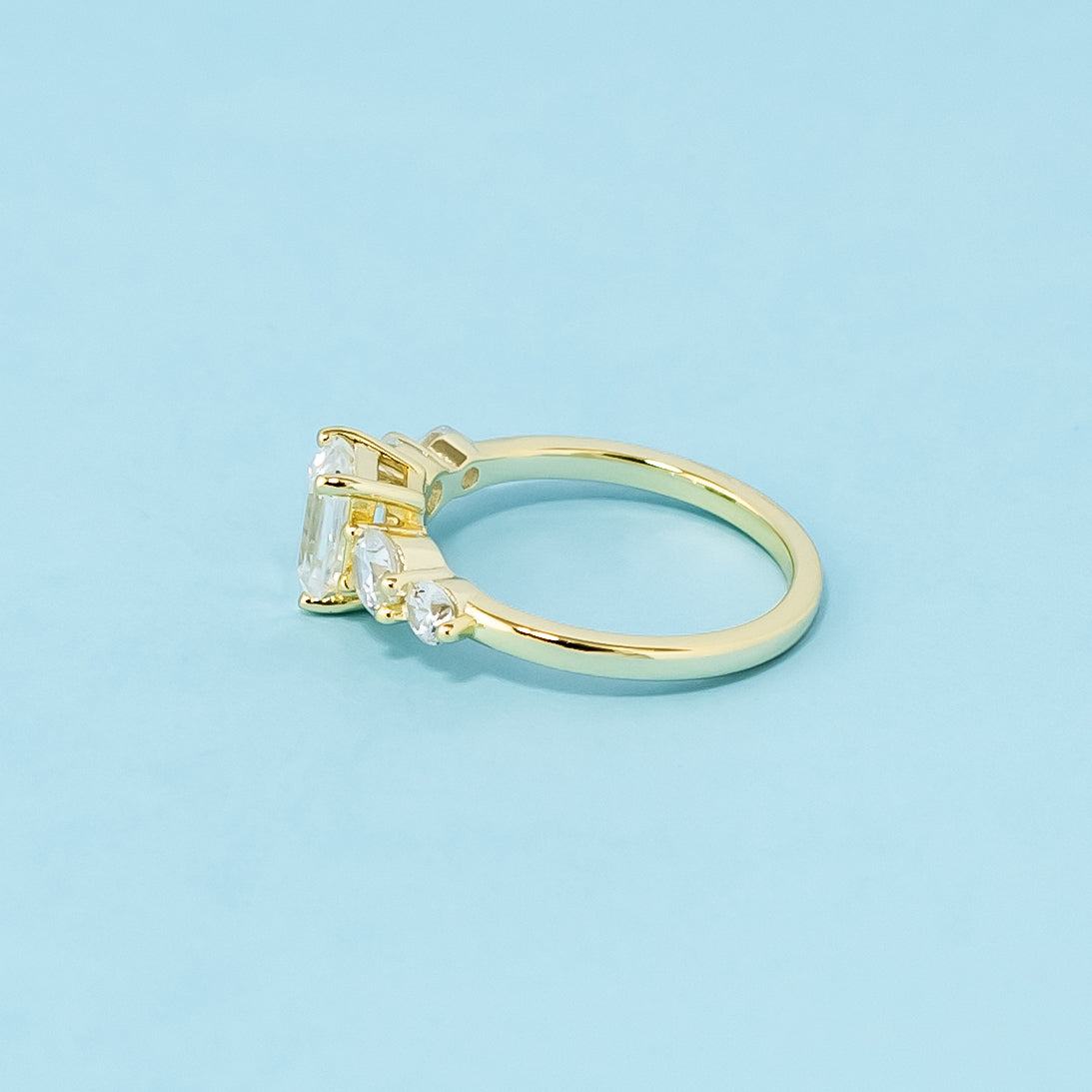 A stunning 9ct yellow gold ring with five beautifully cut emerald moissanites, perfect for symbolizing a lasting commitment.