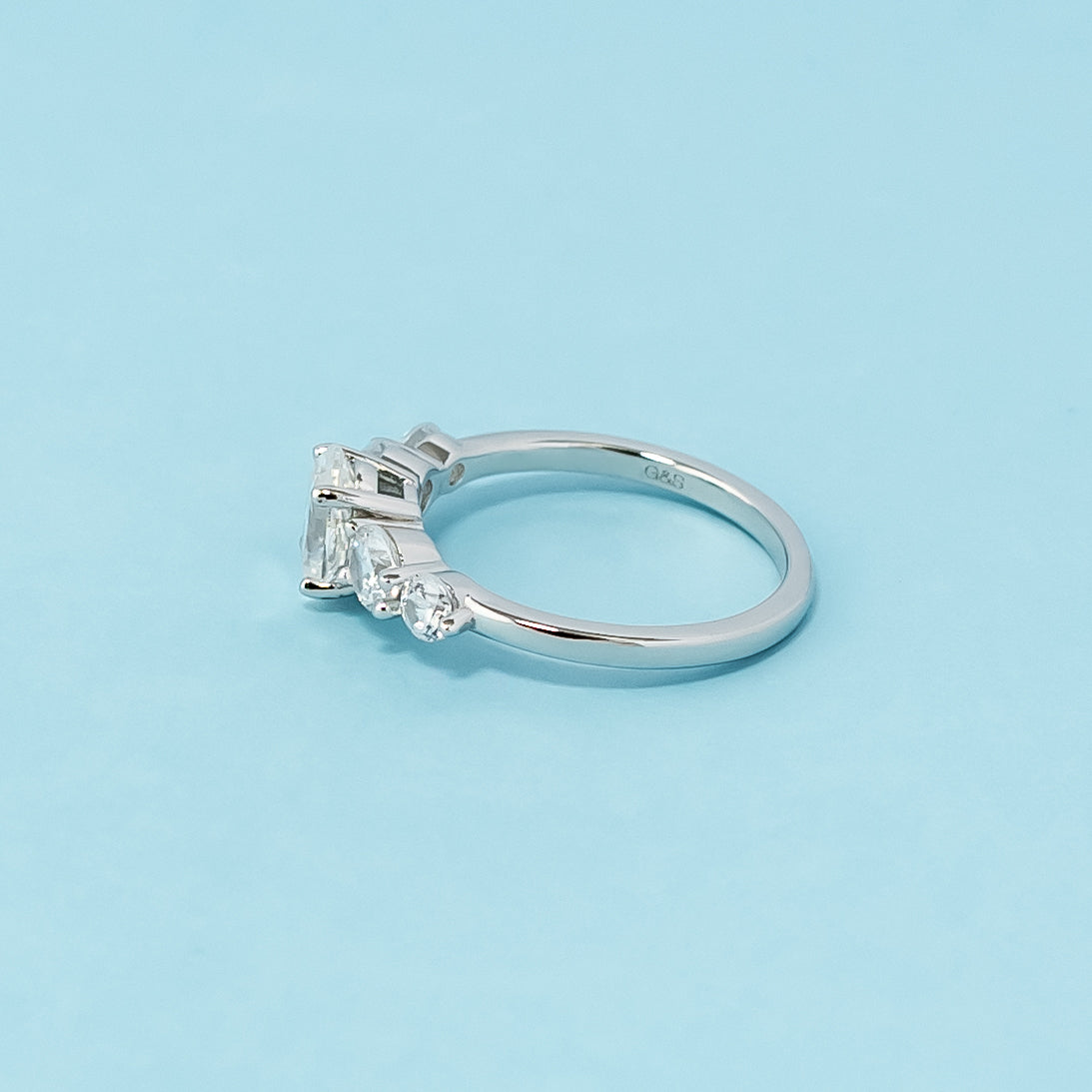 Stunning five-stone engagement ring showcasing the brilliance of oval cut moissanites, crafted in 9ct white gold.