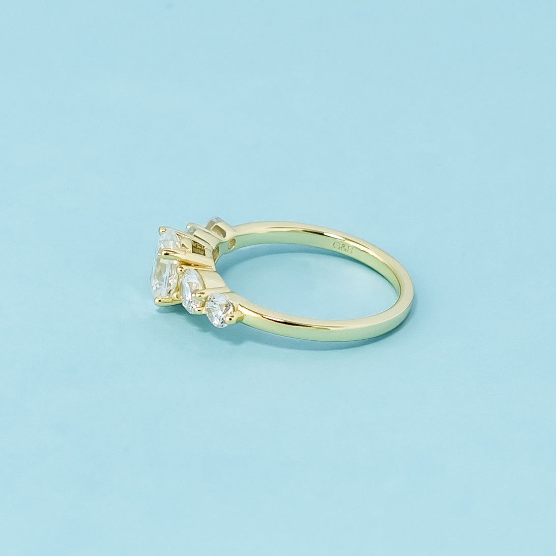 A stunning 9ct yellow gold ring with five beautifully cut oval moissanites, perfect for a meaningful proposal.