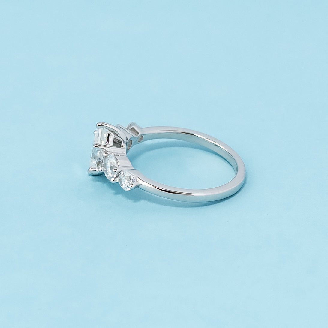 Stunning five-stone engagement ring showcasing the brilliance of pear-shaped moissanites, crafted in 9ct white gold.