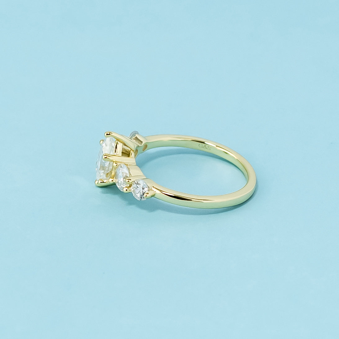 This 9ct yellow gold ring features five beautifully cut pear-shaped moissanites, symbolizing enduring love.
