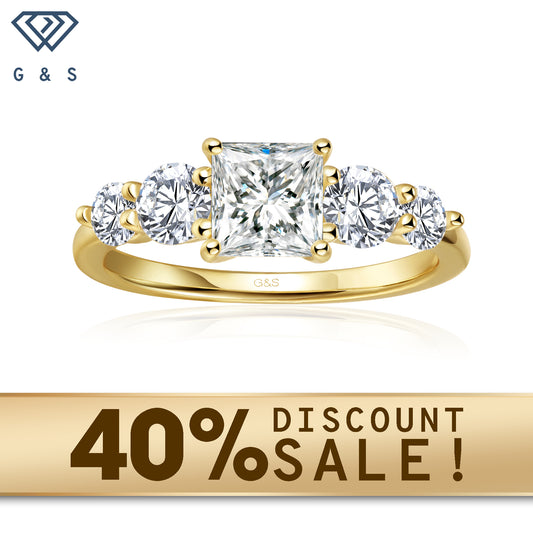 A timeless 9ct yellow gold ring featuring five sparkling princess cut moissanites, symbolizing past, present, and future.