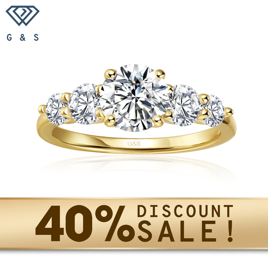 A 9ct yellow gold engagement ring featuring five sparkling round brilliant moissanites, symbolizing enduring love.
