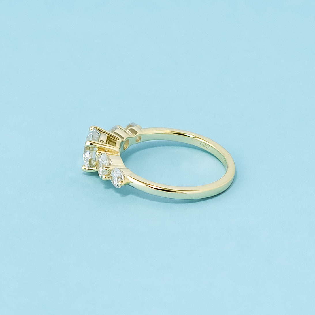 A stunning 9ct yellow gold ring with five dazzling round brilliant moissanites, perfect for symbolizing a lasting commitment.