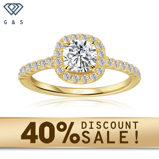A 9ct yellow gold engagement ring featuring a cushion cut moissanite encircled by a sparkling halo.