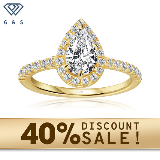 A 9ct yellow gold engagement ring featuring a pear-shaped moissanite encircled by a sparkling halo.