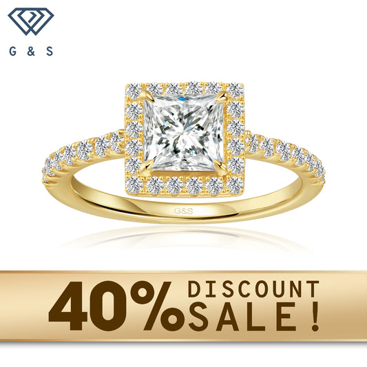 A 9ct yellow gold engagement ring featuring a princess cut moissanite surrounded by a sparkling halo.