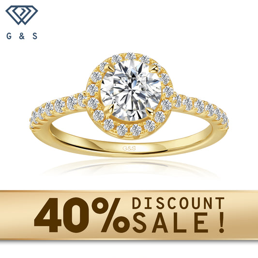A 9ct yellow gold engagement ring featuring a round brilliant moissanite surrounded by a sparkling halo.