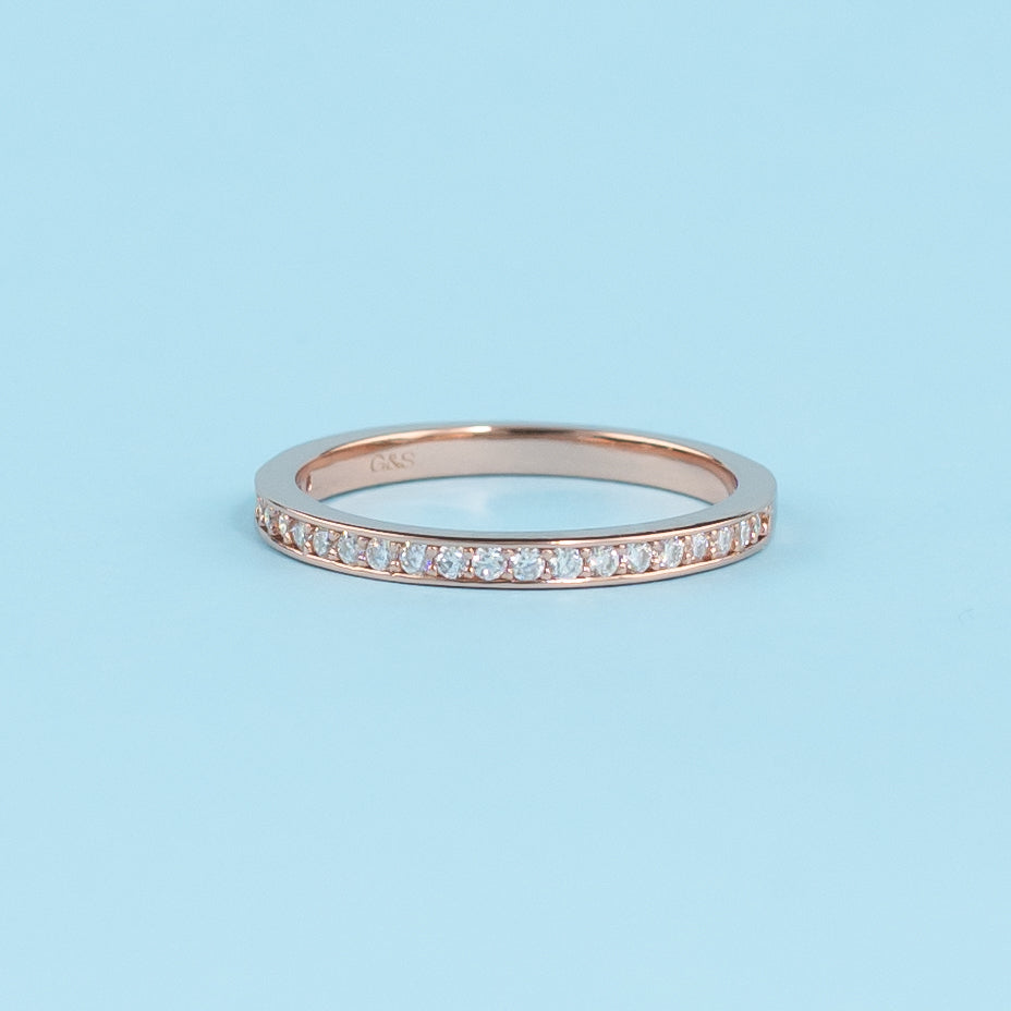 Elegant 9ct rose gold wedding band set featuring a classic pave setting with sparkling moissanites.