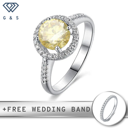 A sterling silver engagement ring featuring a 1.00ct yellow moissanite center stone surrounded by a delicate heart-shaped halo of smaller stones.