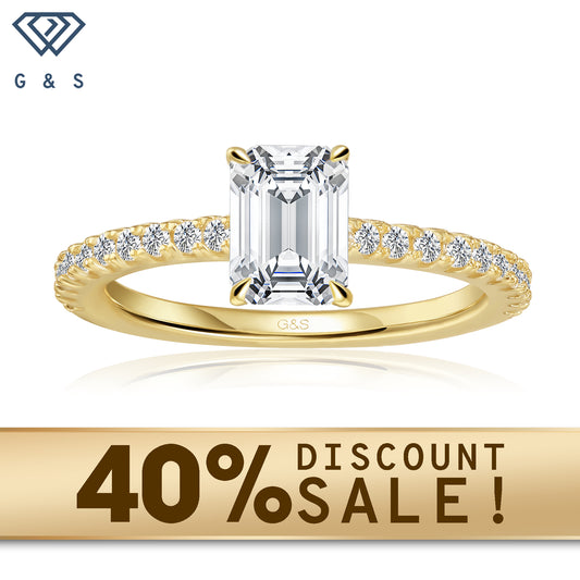 A 9ct yellow gold engagement ring featuring a hidden halo and a 1.00ct emerald cut moissanite.