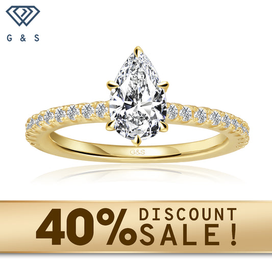 A 9ct yellow gold engagement ring featuring a pear-shaped moissanite with a hidden halo for extra sparkle.