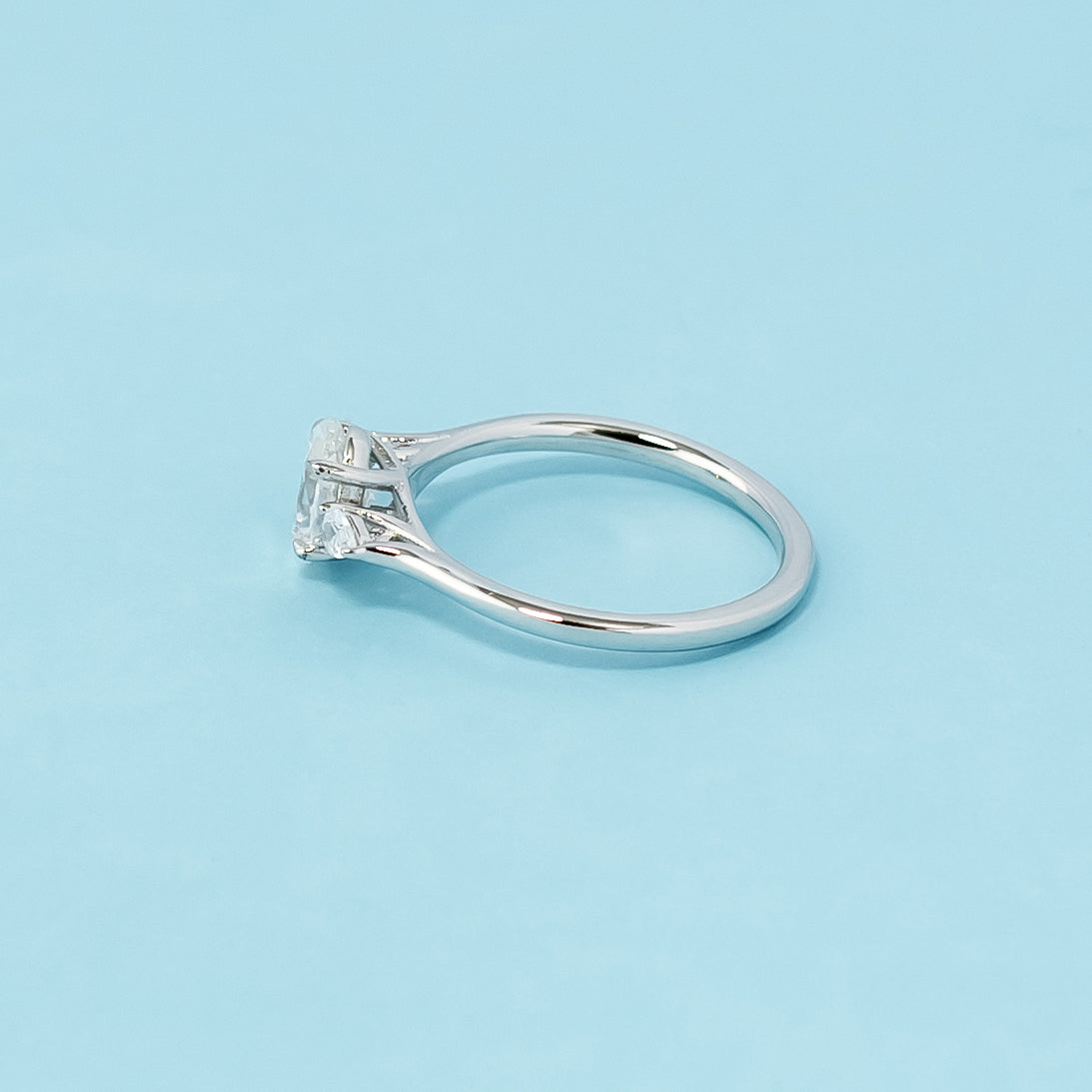 Modern and meaningful engagement ring showcasing oval cut moissanites symbolizing past, present, and future love, set in 9ct white gold.