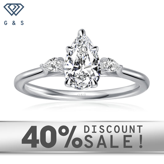 Infinite Love Trilogy pear-shaped moissanite engagement ring set in 9ct white gold.