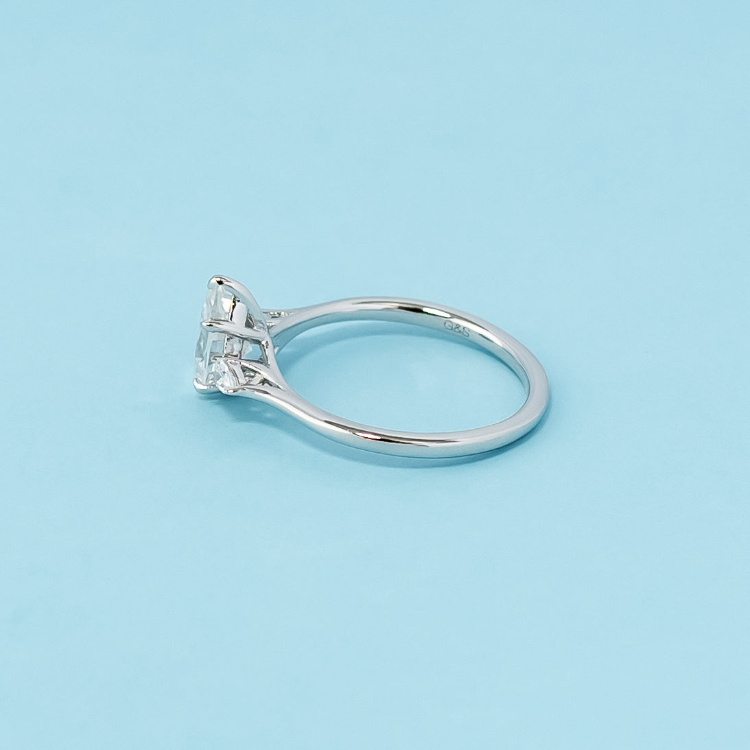 Modern and meaningful engagement ring showcasing pear-shaped moissanites symbolizing past, present, and future love, set in 9ct white gold.