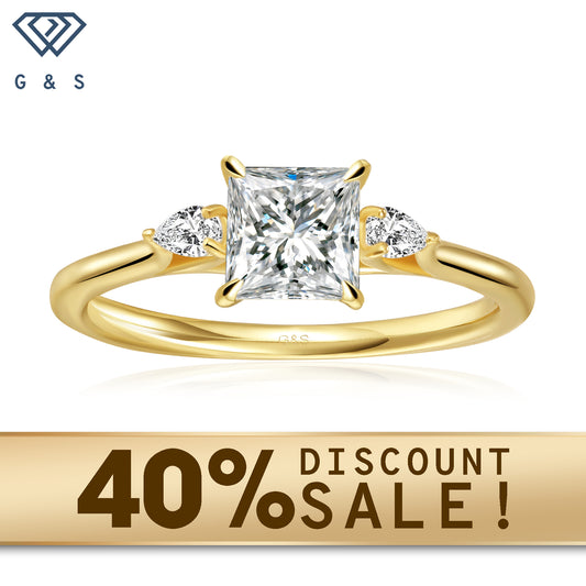 A 9ct yellow gold engagement ring featuring three princess cut moissanites, symbolizing past, present, and future.