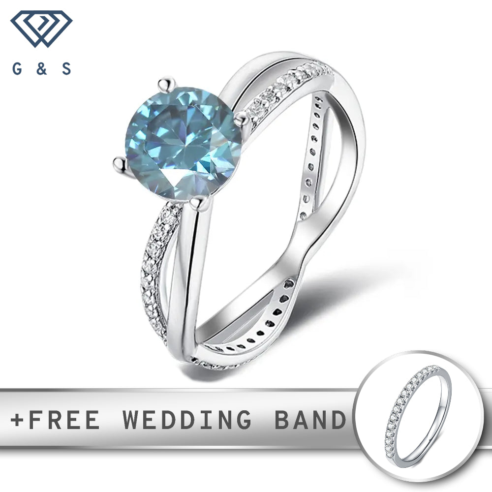 A detailed view of a sterling silver engagement ring featuring a vibrant 1.00ct blue moissanite center stone, intricately set within a flowing infinity design.