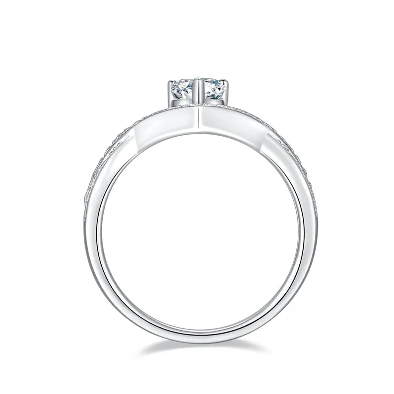 Elegant and timeless infinity engagement ring with a dazzling pear moissanite center stone.