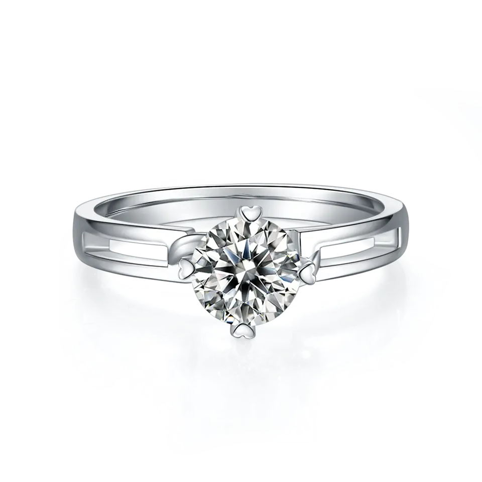 This ring showcases a brilliant 1.00ct moissanite held in a classic setting atop a sterling silver band incorporating a delicate infinity twist.