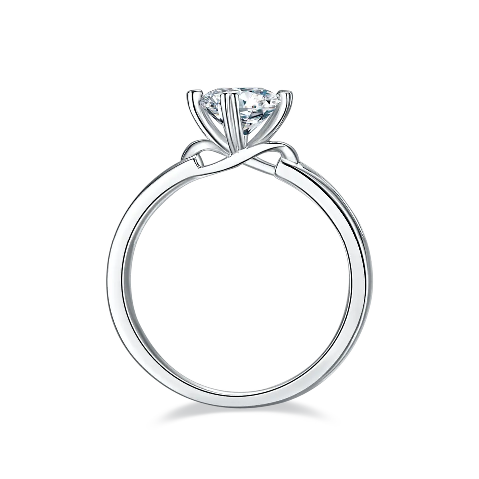 An eye-catching engagement ring combining the sparkle of a 1.00ct moissanite with the symbolic infinity motif crafted in sterling silver.