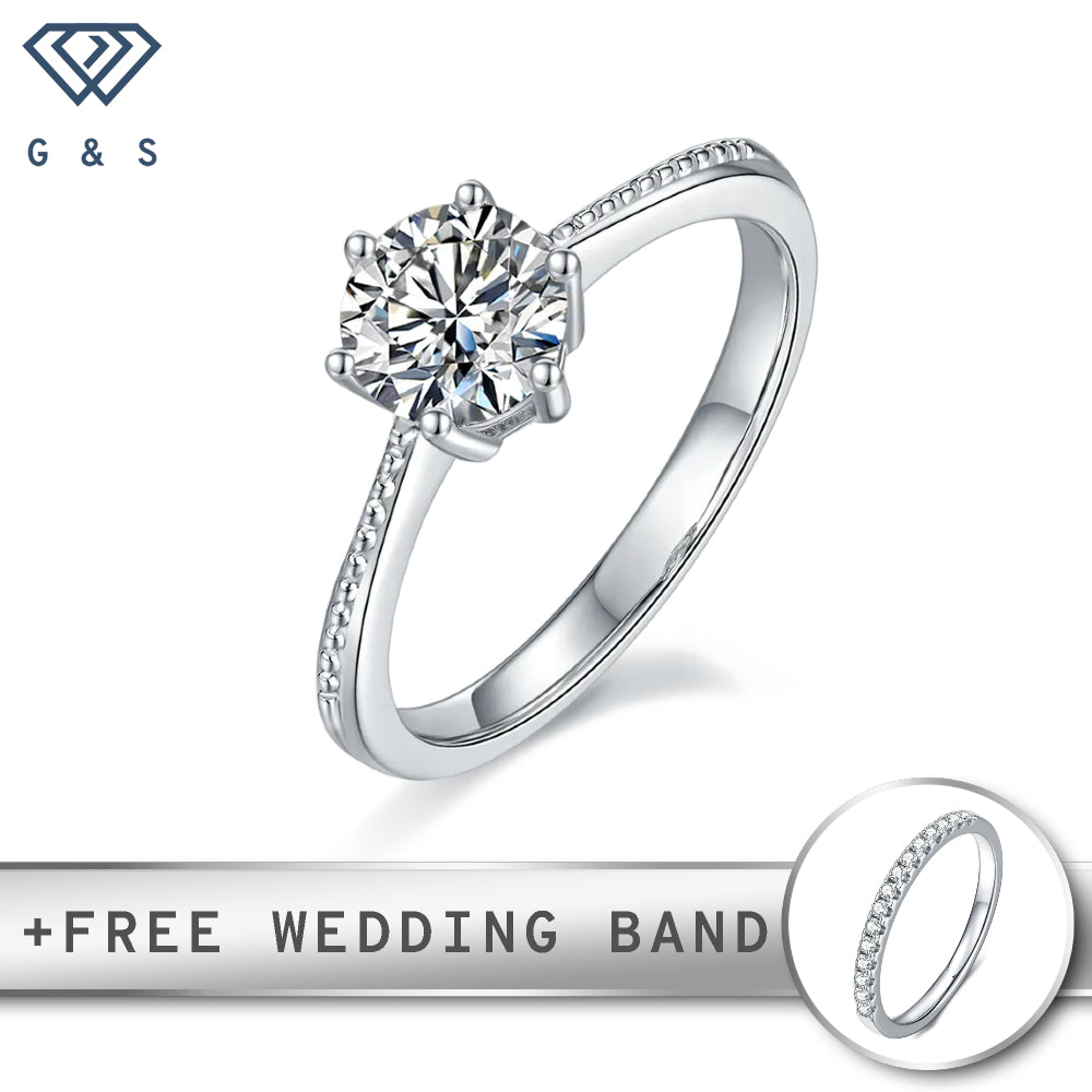 A classic sterling silver engagement ring featuring a brilliant 1.00ct moissanite in a secure 6-claw setting, accented with delicate milgrain detailing.