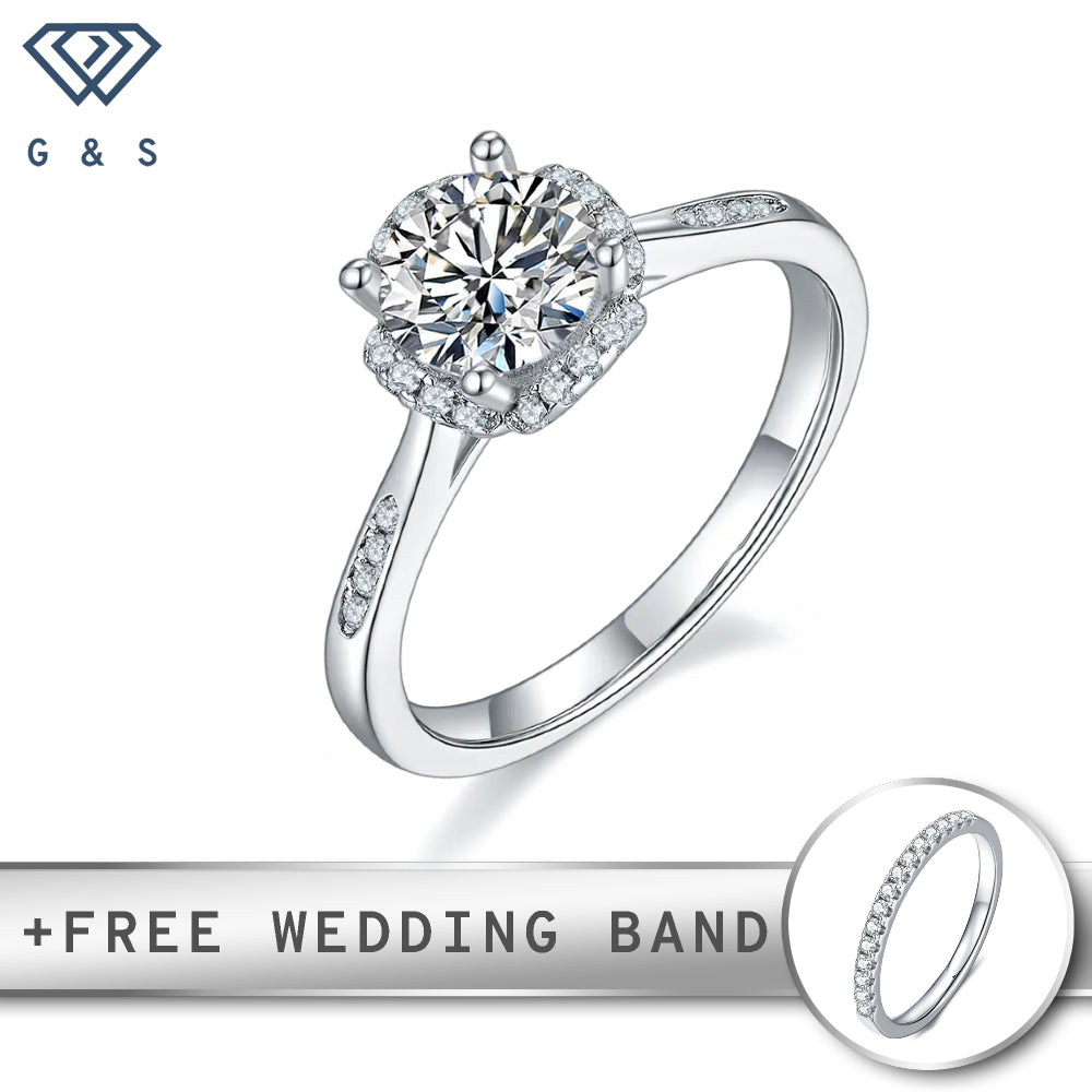 A contemporary engagement ring featuring a brilliant 1.00ct moissanite center stone surrounded by a sparkling halo, set in polished sterling silver.