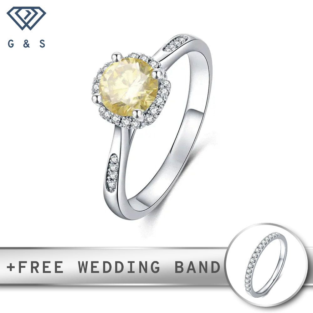 A contemporary design featuring a 1.00ct yellow moissanite center stone surrounded by a sparkling halo, all elegantly crafted in lustrous sterling silver.