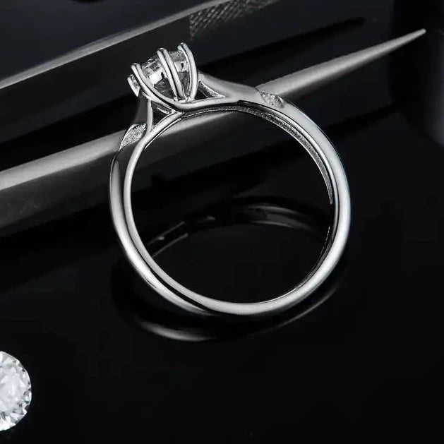 Minimalist solitaire engagement ring showcasing a brilliant 0.50-carat moissanite.