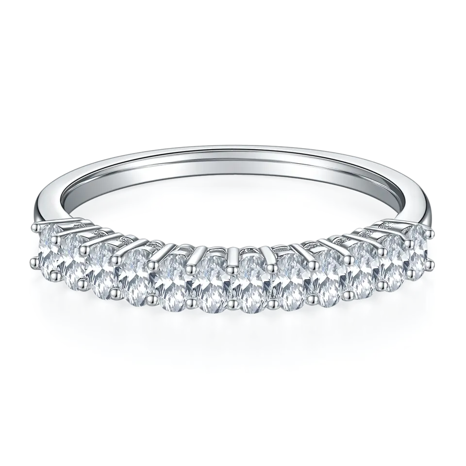 This wedding band set showcases brilliant oval-cut moissanites set halfway around the band, creating a continuous sparkle in a polished sterling silver setting.