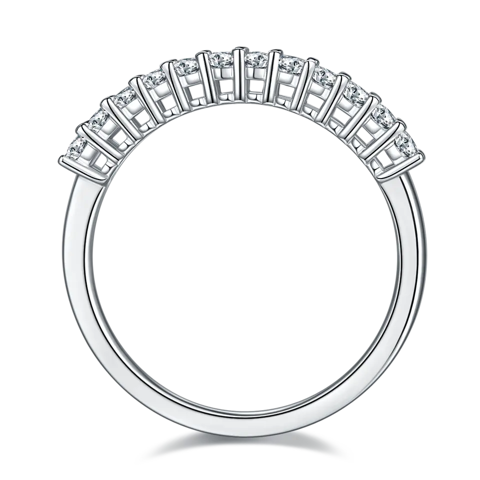 A classic and elegant wedding band set featuring oval-cut moissanites in a half eternity setting, crafted from high-quality sterling silver.