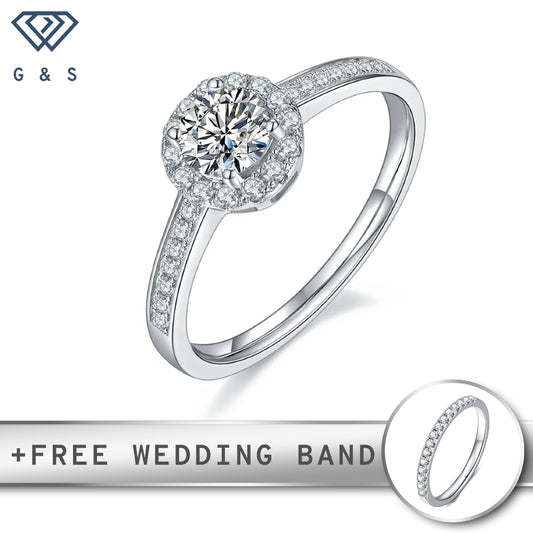 A delicate sterling silver engagement ring featuring a 0.50ct moissanite center stone surrounded by a sparkling pave halo.