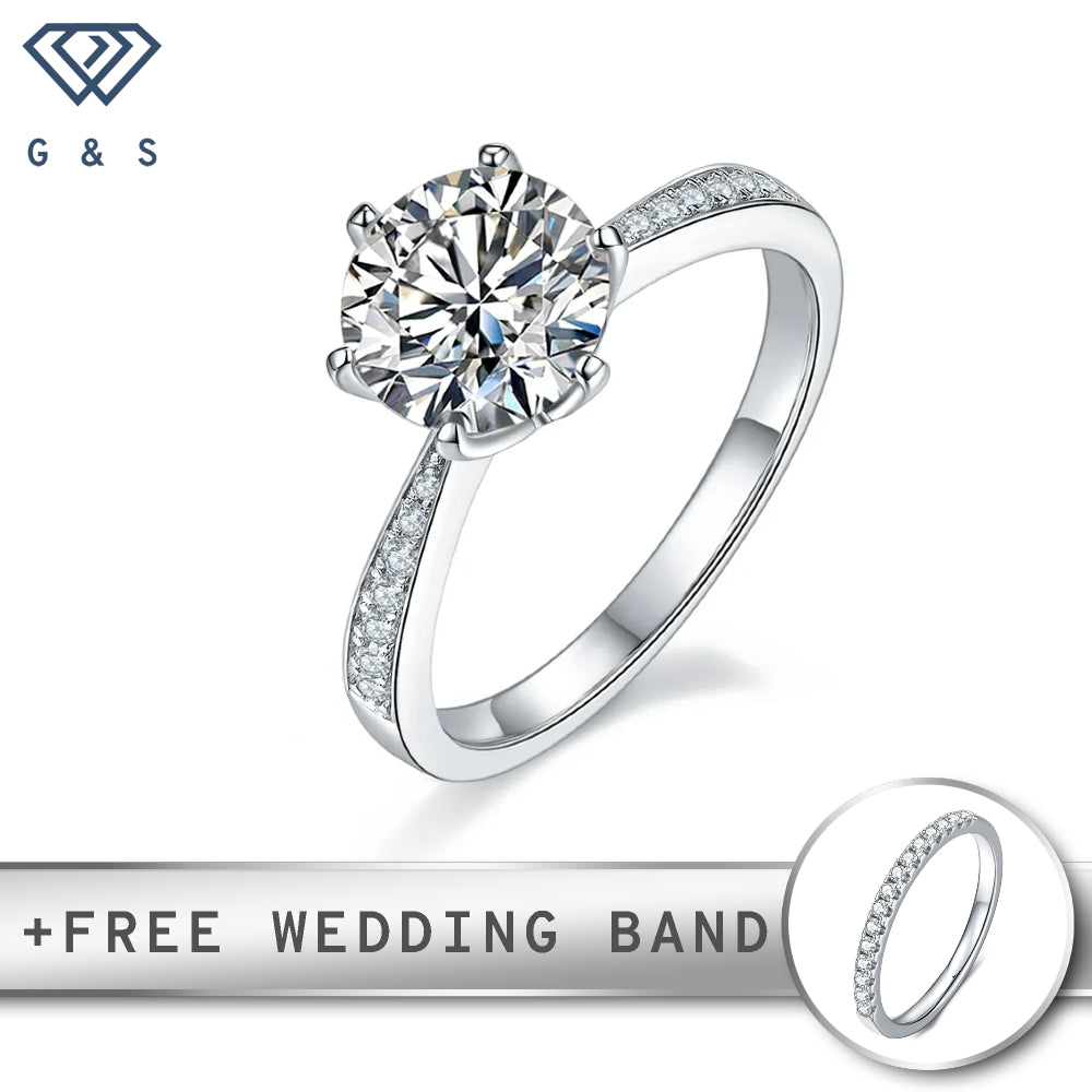 A classic Tiffany 6-claw setting showcasing a brilliant 2.00ct moissanite, with a delicate pave band in sterling silver.