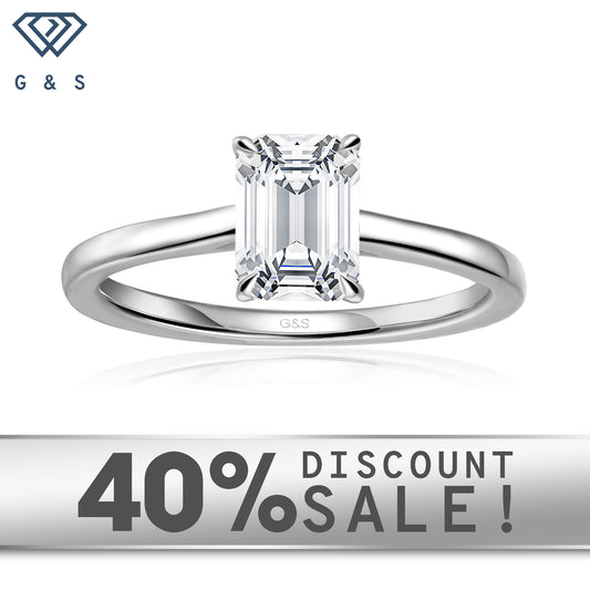 Secret Sparkle Hidden Halo emerald cut moissanite engagement ring set in 9ct white gold.