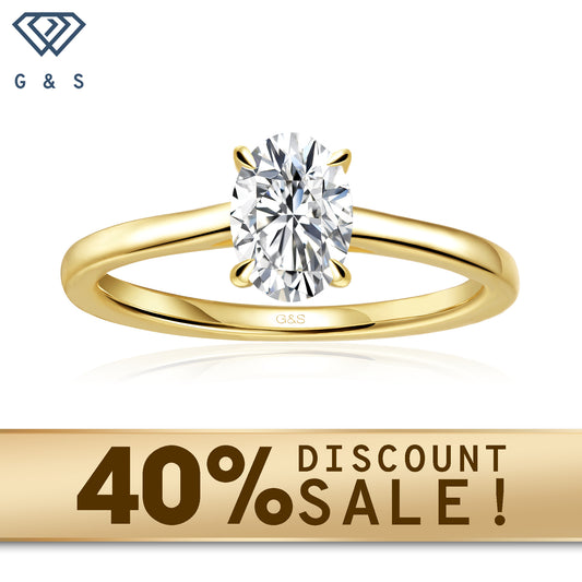 A 9ct yellow gold engagement ring featuring a brilliant oval cut moissanite with a hidden halo for added sparkle.