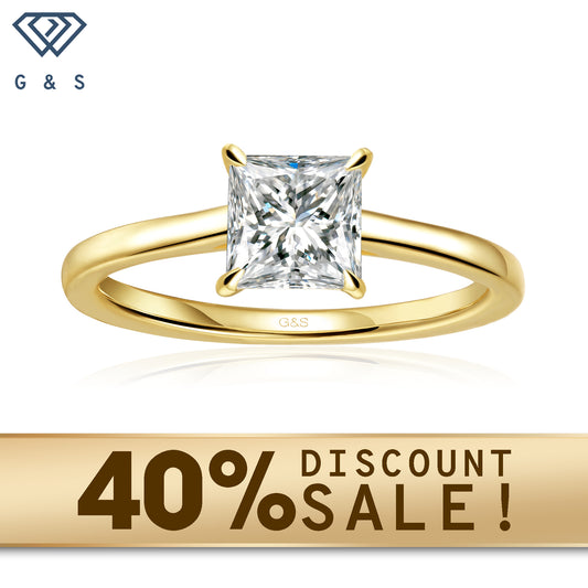A 9ct yellow gold ring featuring a sparkling princess cut moissanite with a secret halo for added brilliance.