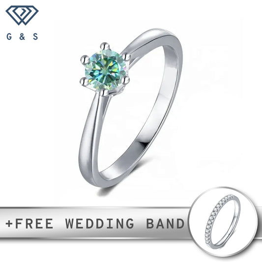 A sterling silver engagement ring with a 6-claw floral basket setting holding a vibrant 0.50ct green moissanite.