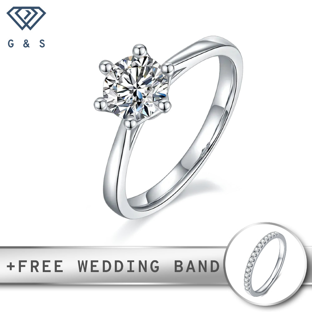 A classic engagement ring featuring a 1.00ct moissanite, held securely by six claws in a delicate floral basket setting, set in polished sterling silver.

