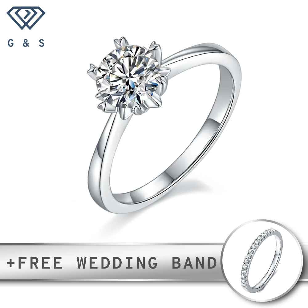 A classic engagement ring featuring a 1.00ct moissanite, held securely by six delicate heart-shaped prongs, set in polished sterling silver.