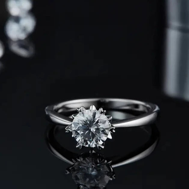 The light reflects beautifully on the moissanite stone.