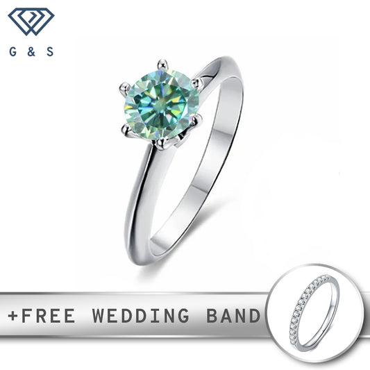 A classic sterling silver engagement ring featuring a vibrant 1.00ct green moissanite in a timeless six-prong Tiffany setting.