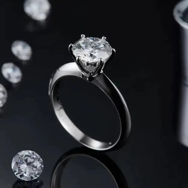 A beautiful 2.00ct moissanite shines brightly in this classic Tiffany setting, crafted in 9ct white gold.