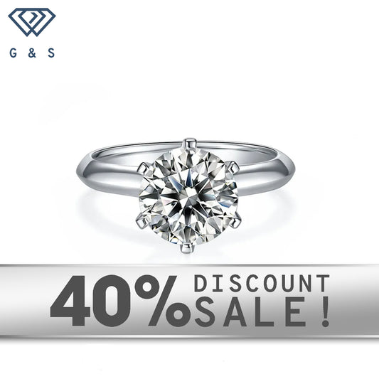 A 3.00ct moissanite sparkles in a timeless 6-claw Tiffany setting on a 9ct white gold band.