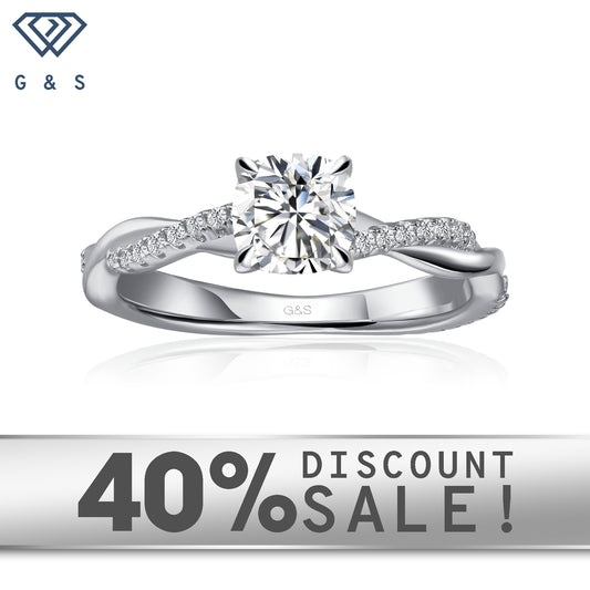 Timeless Infinity Cushion Cut Moissanite Engagement Ring Set in 9ct White Gold:  A classic engagement ring featuring a cushion-cut moissanite in a timeless infinity setting, crafted in 9ct white gold.