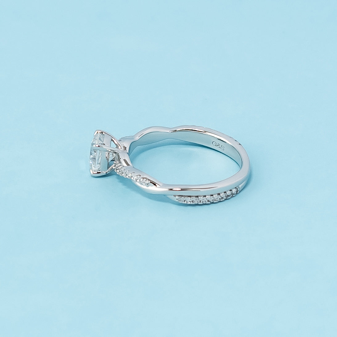 Symbolize Everlasting Love with this Infinity Cushion Cut Moissanite Ring: This 9ct white gold engagement ring showcases a sparkling cushion-cut moissanite within a timeless infinity setting, representing eternal commitment.
