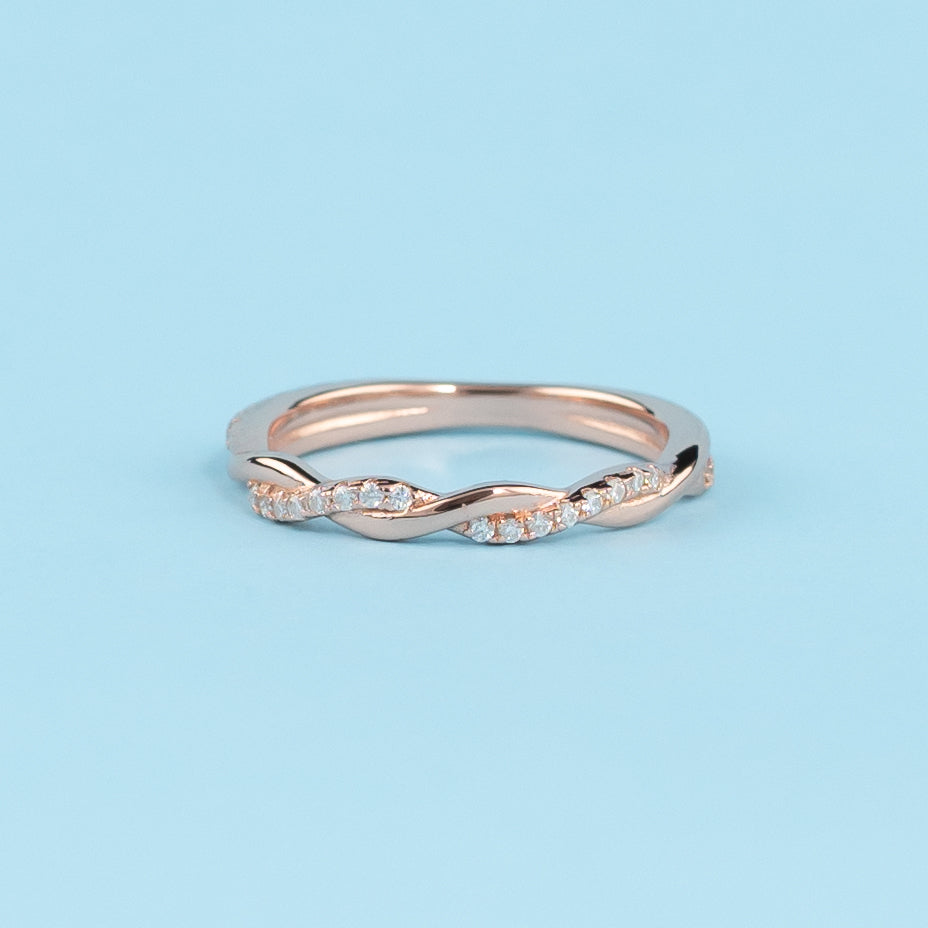Elegant 9ct rose gold wedding band set featuring an infinity design with sparkling moissanites.