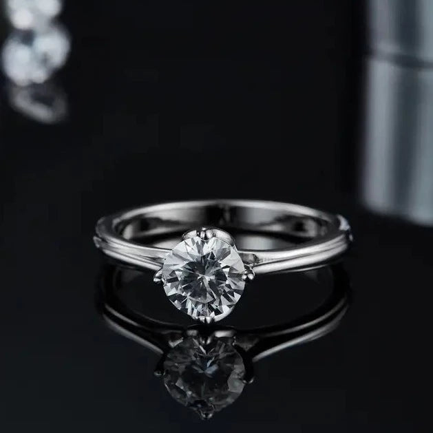 A timeless sterling silver solitaire ring with a 1.00ct moissanite, elevated by a unique tulip-style setting.