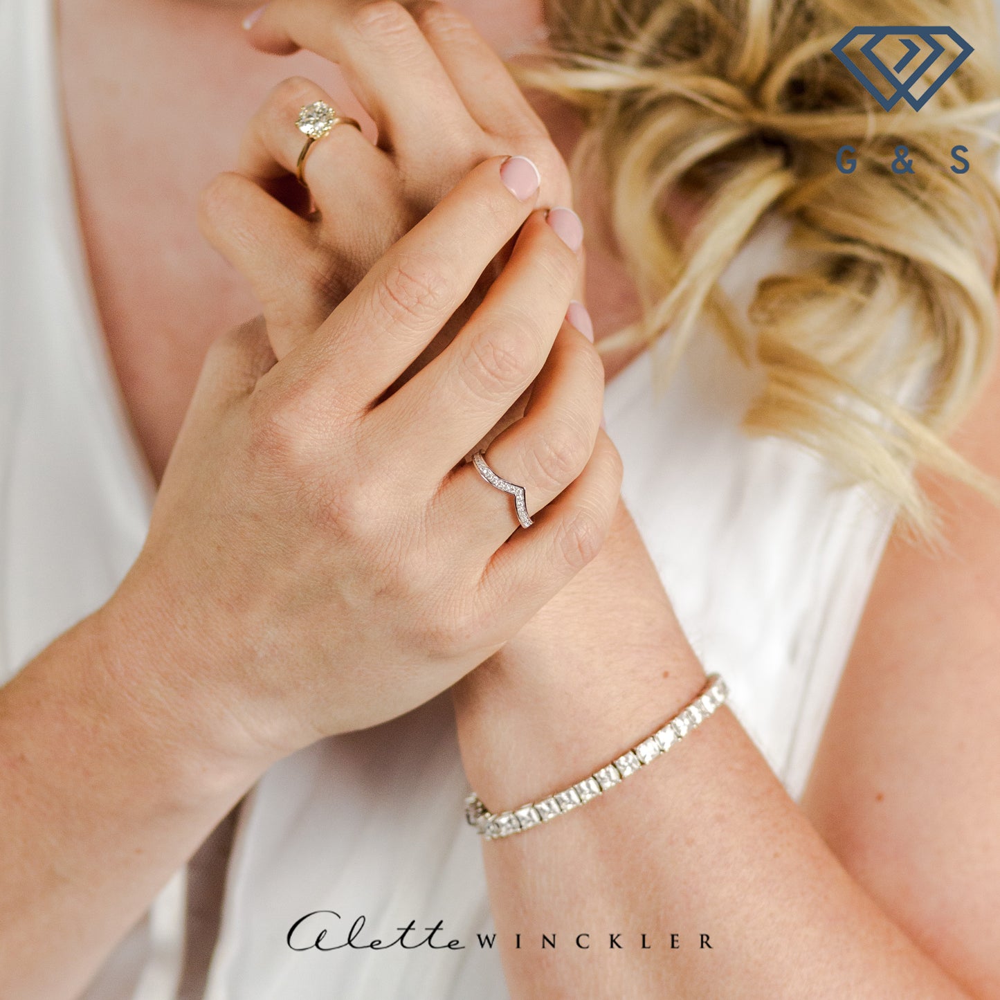 This ring showcases a unique wishbone design that wraps around the entire finger, adorned with shimmering pave-set moissanites for endless sparkle.